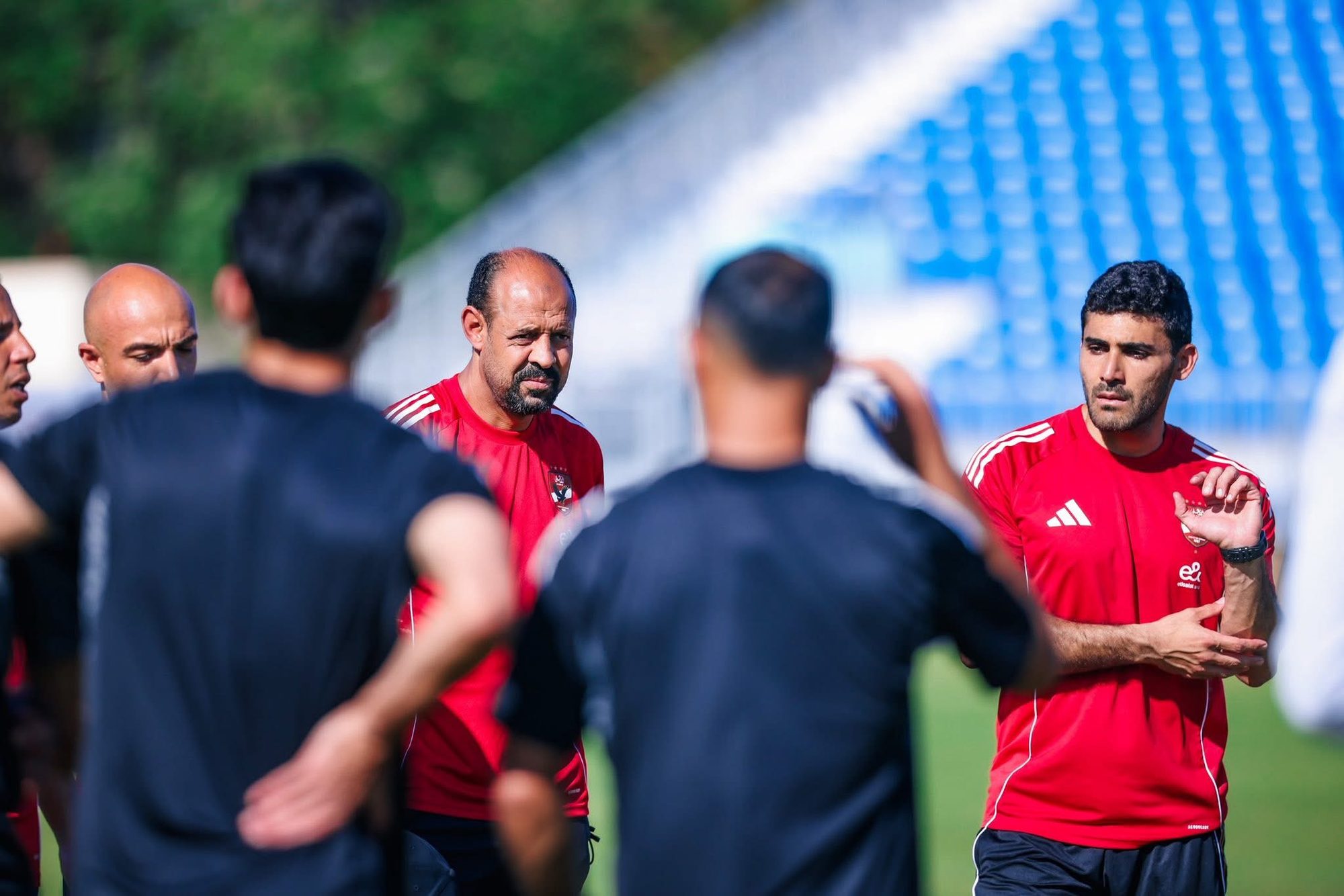 Shihy explaining a drill to players