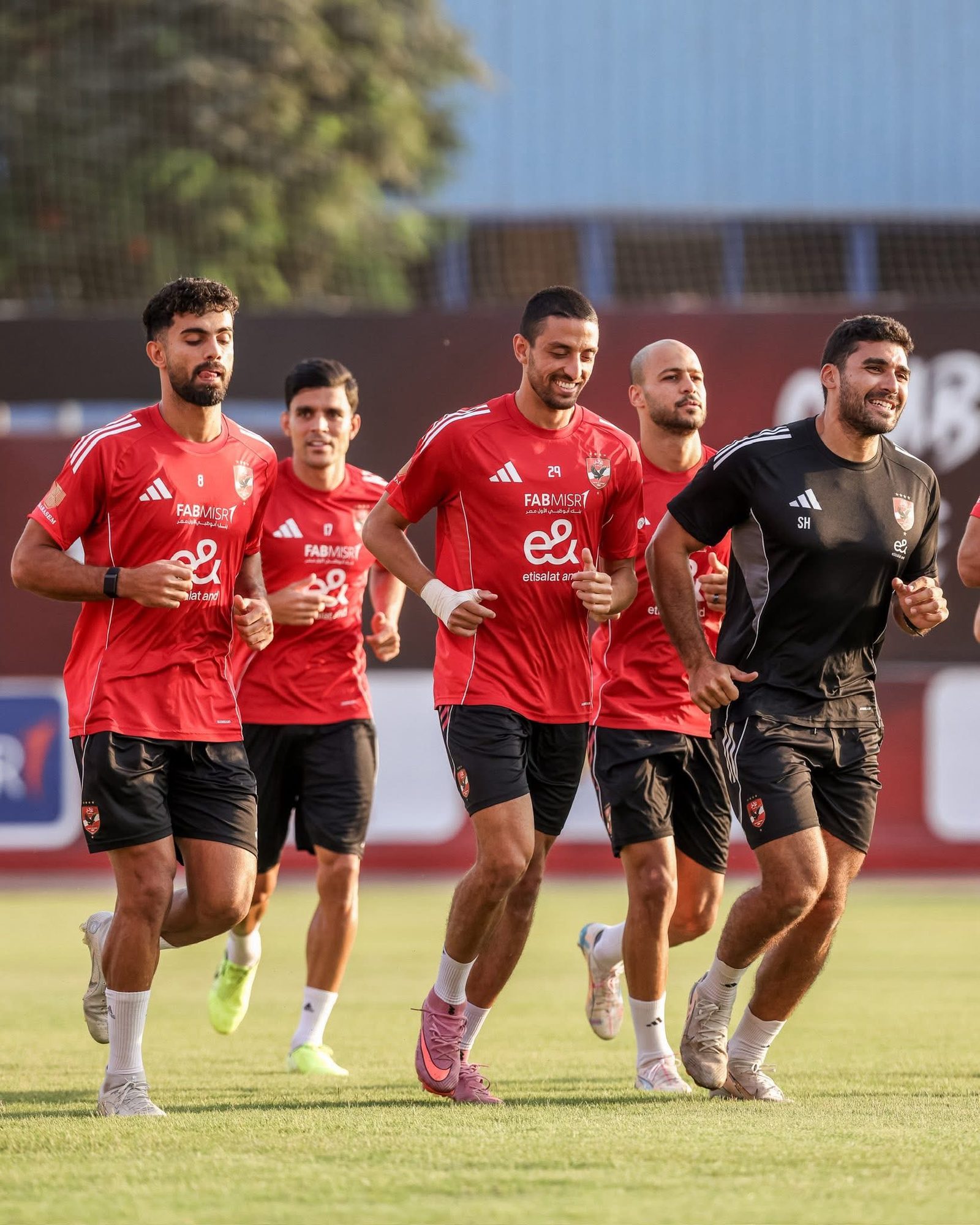 Players running with Shihy at training